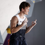 Picture of Nathaniel Coleman celebrating after completing a boulder